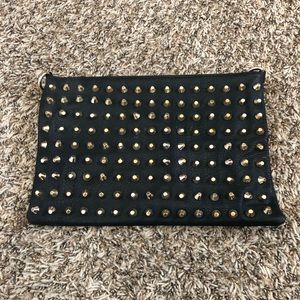 Black faux leather spike clutch or cross body.